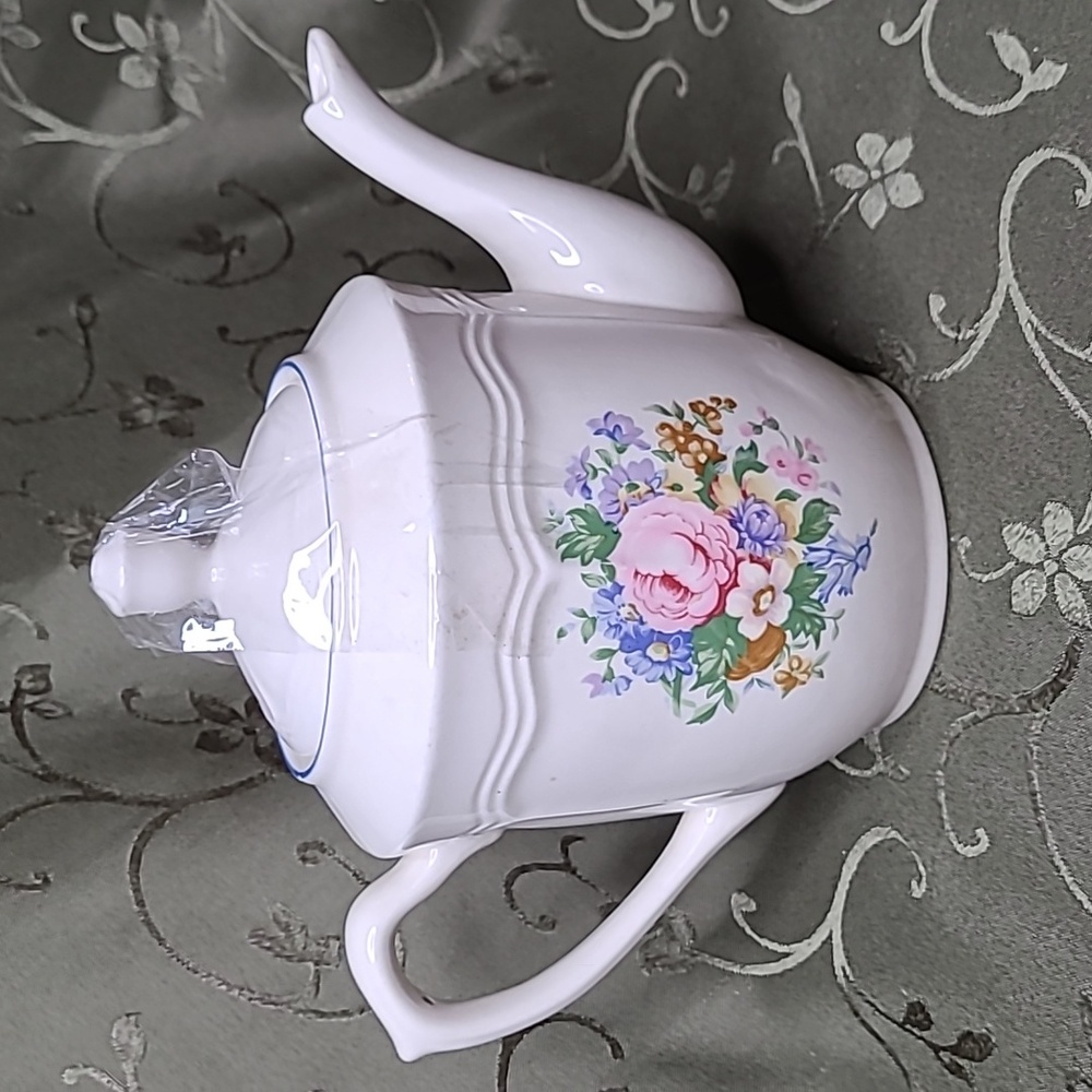 Tabletops Unlimited floral teapot, 7 x 8
